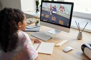 Student watching screen remote learning science lesson