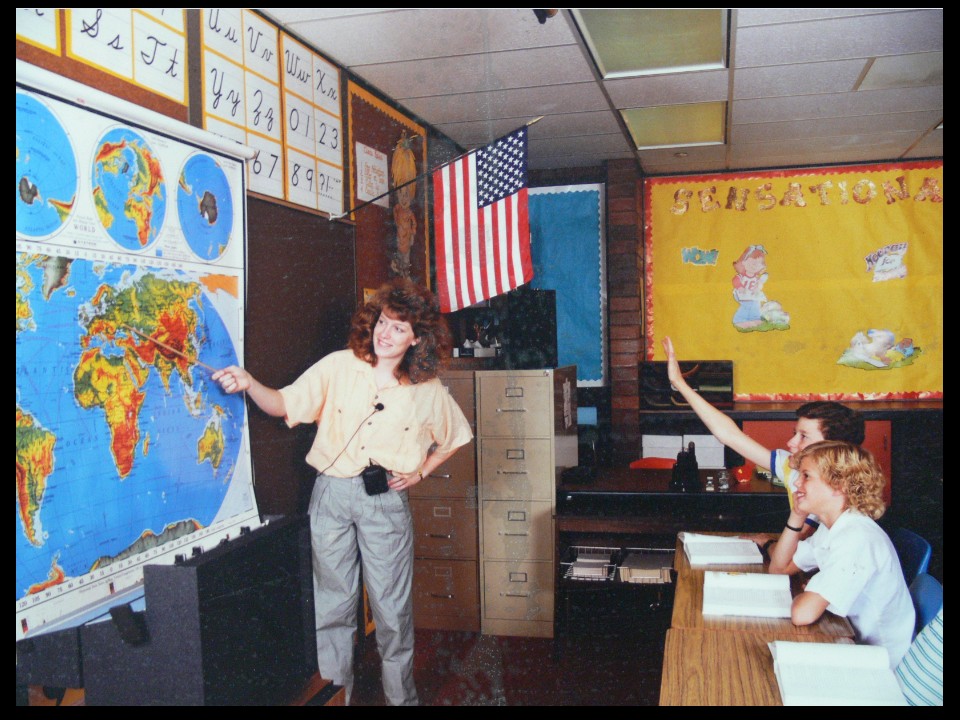 Jennifer Crum modeling the Audio Enhancement Teacher Mic in the Classroom