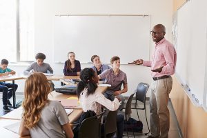 Confident teacher in front of class